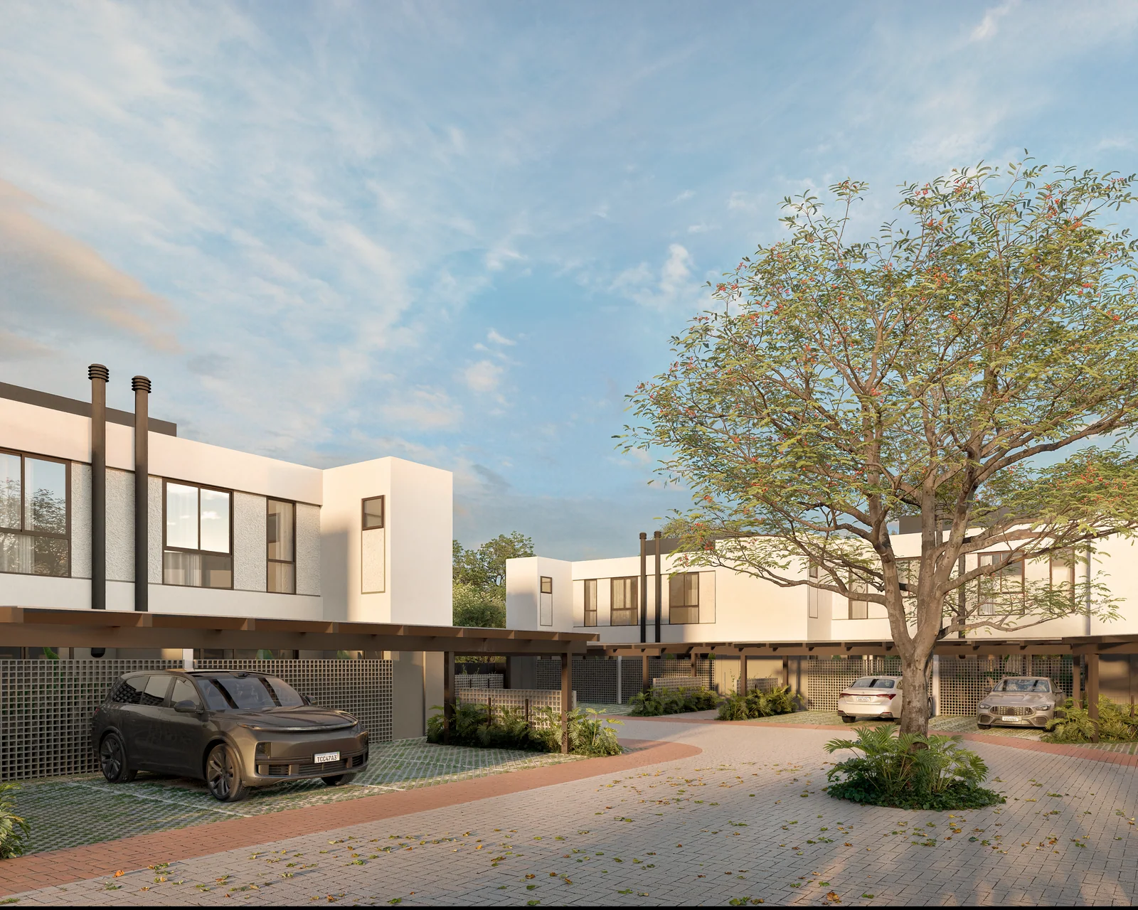 Rua interna arborizada com jardins e fachadas das Casas Pátio